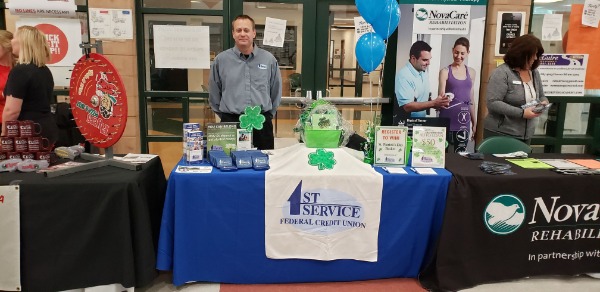 first service promotional table with shamrock decorations