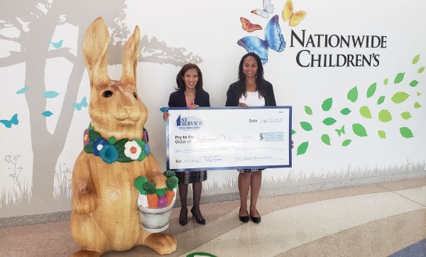 First Service presenting check to Nationwide Children's around Easter 2019