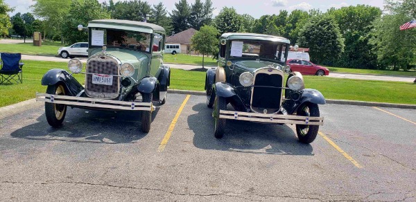 two antique classic cars