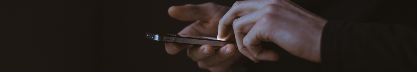 person using cell phone in the dark