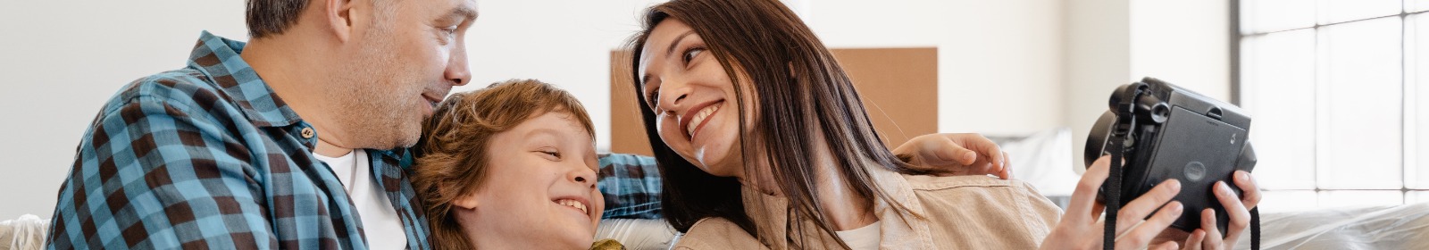 family looking at camera on couch