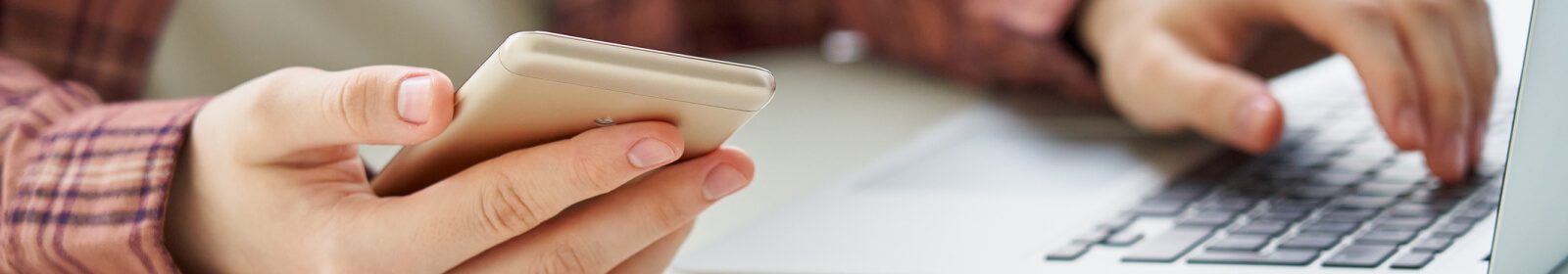 Close up of hands holding a smartphone